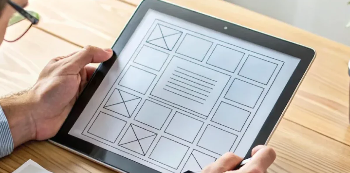 Tablet device displaying UI wireframe layout sketches and AI system architecture flowchart.