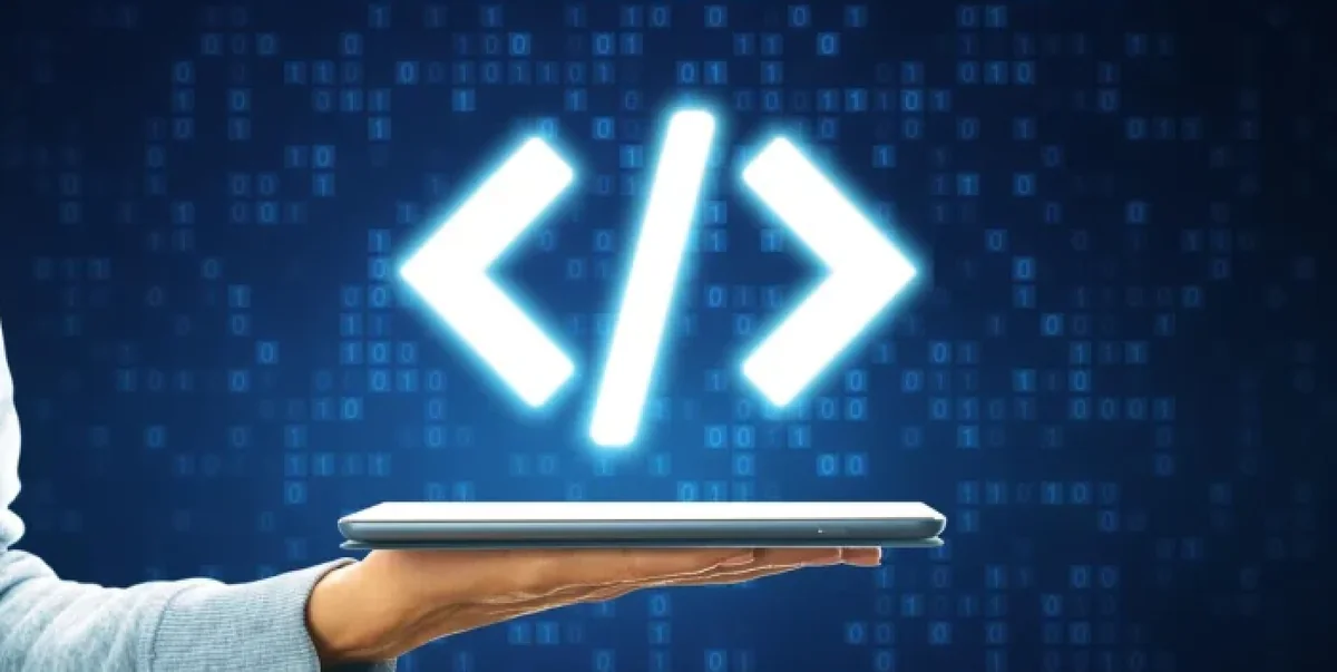 Glowing cyan code bracket hologram symbol floating above a digital tablet in a lab.
